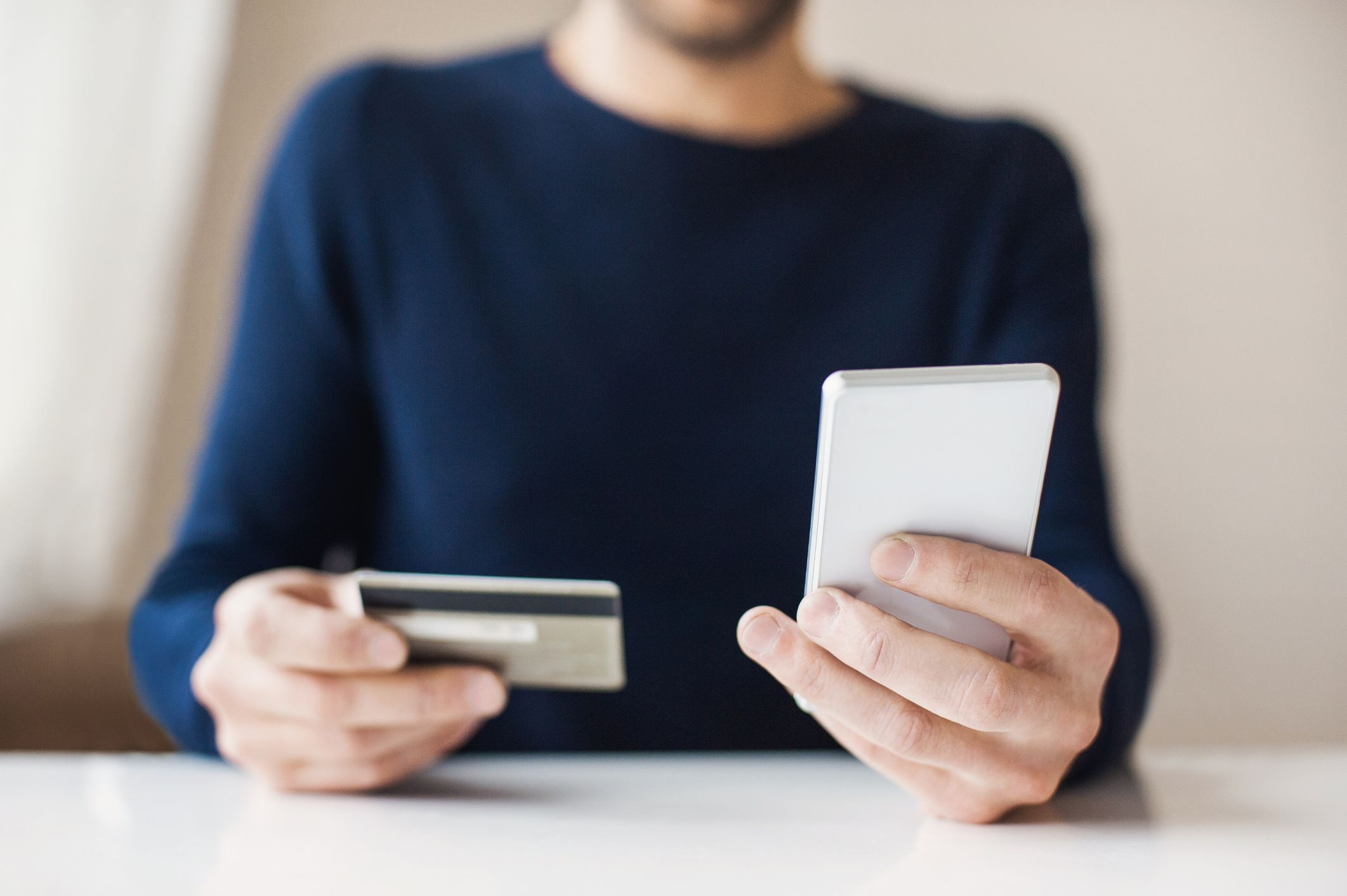 Man is shopping online with smartphone